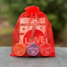Load image into Gallery viewer, Love Brews Magic set - Spicy Papa, Captain's, Hot Momma, spoon, sticker and card in a red mesh bag
